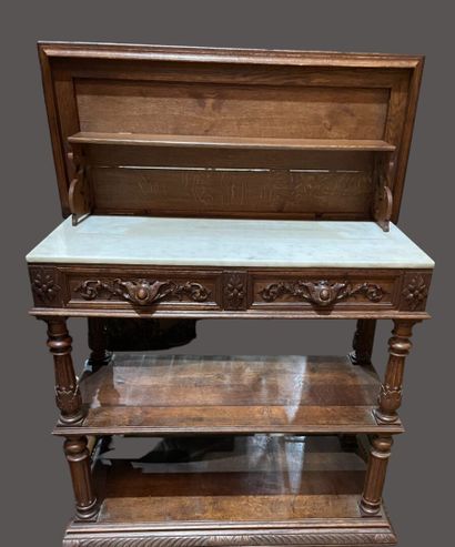 null Carved oak console, opening to a flap revealing a marble top, 2 drawers in the...