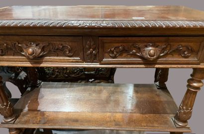 null Carved oak console, opening to a flap revealing a marble top, 2 drawers in the...