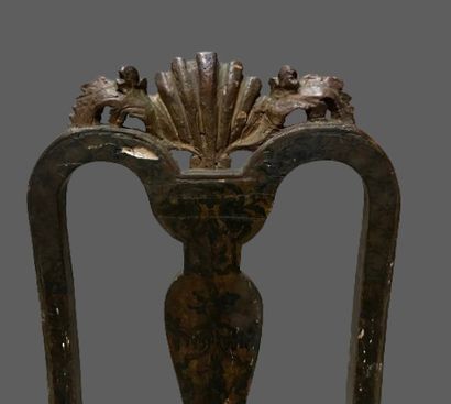 null Suite of six chairs in carved and painted wood with foliage. 
The front legs...