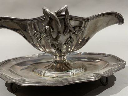 null Pair of silver saucers with adhering tray, the handles in vine branches. 
One...