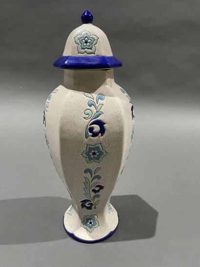 null LONGGWY
Enameled earthenware hexagonal covered vase with flowers on a white...