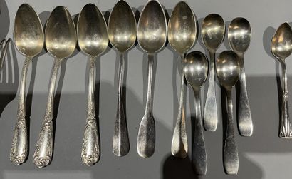 null Set of mismatched silver-plated flatware.