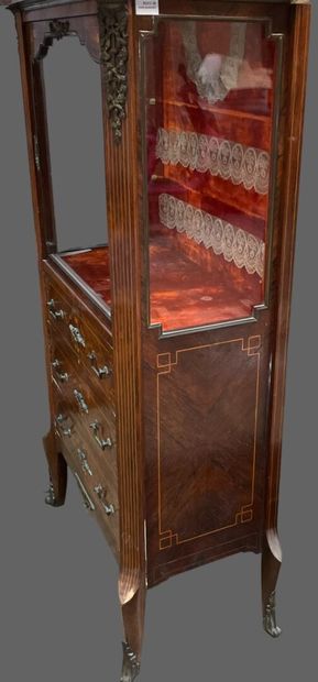 null Rosewood veneered display cabinet with three drawers and a glass door.
Transition...