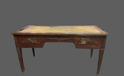 null Mahogany veneered flat desk with four sheath legs, leather-covered top with...