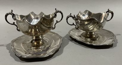 null Pair of silver sauce boats with adherent tray and leafy handles.
Goldsmith :...