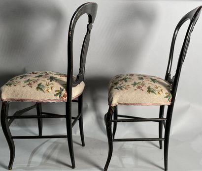 null Pair of black lacquered chairs, upholstered with a floral tapestry. 
Napoleon...