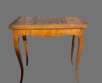null Rectangular walnut veneered game table, the top inlaid with a checkerboard.
Provincial...