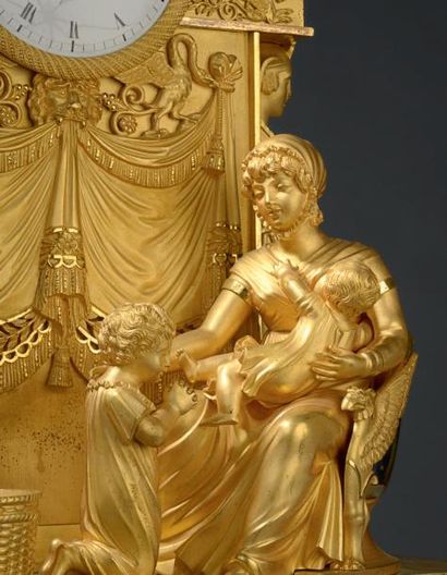 null Pendule en bronze doré amati et satiné, représentant la Naissance du Duc de...