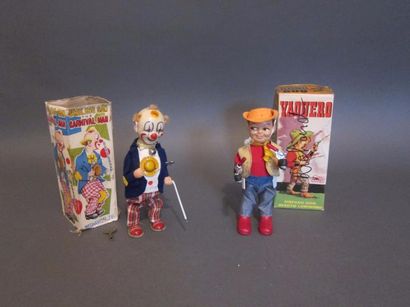 null Deux jouets mécaniques et à piles figurant un clown et un cow-boy.
