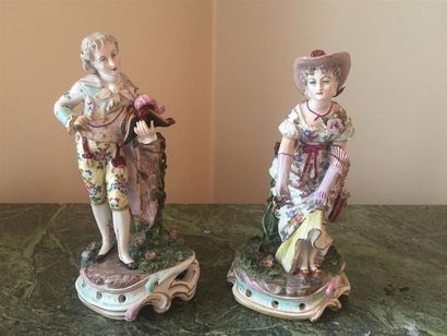 null -Couple galant : Deux statuettes en porcelaine dans le goût de la Saxe.

On...