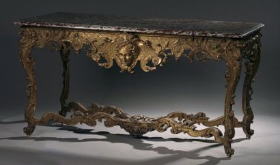 null Table console en bois sculpté et doré à décor ajouré de feuillages, mascaron,...