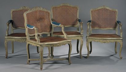 null Quatre fauteuils cannés en bois repeint à dossier plat et décor de feuillages...