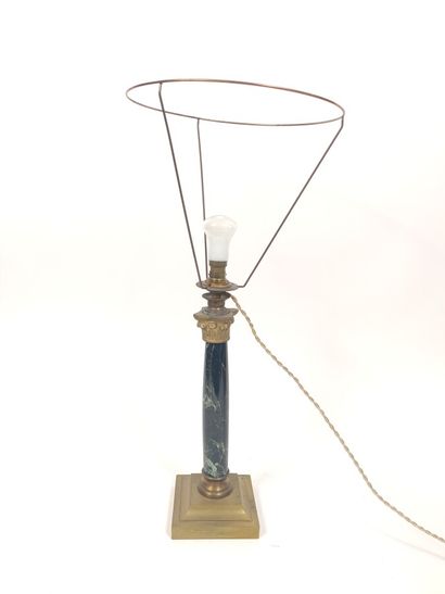  Lamp with a green veined marble column and a gilded bronze capital ; on a quadrangular...