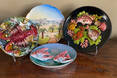  A set including : a "Nice" plate, a "lobster" plate, a "fish" plate, a "two pink...