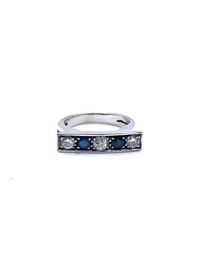  White gold (750) "barrette" ring. The openwork body is set with an alignment of...