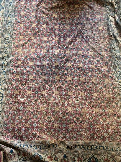 Oriental carpet with floral decoration on...