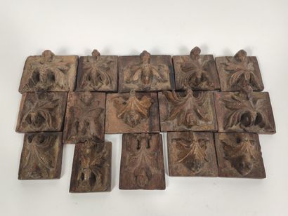 Set of fifteen sconces in carved wood.