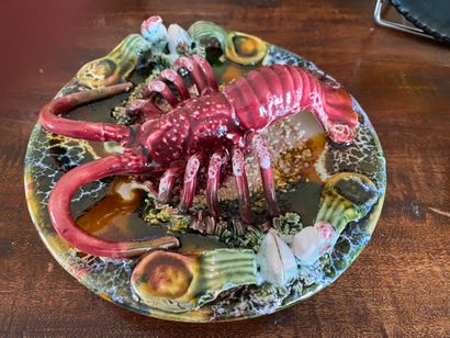  A set including : a "Nice" plate, a "lobster" plate, a "fish" plate, a "two pink...