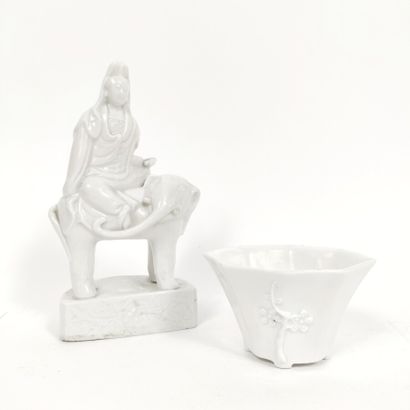  CHINA, 
Guanyin in Chinese white represented sitting on an elephant, a scroll in...