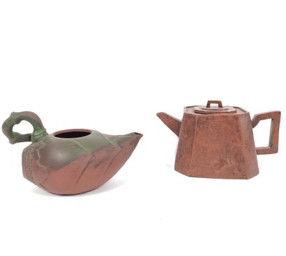  Set of two yixing stoneware teapots: 
One octagonal (H:6.5 cm) , the other decorated...
