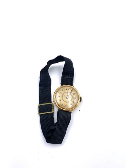  . BRACELET WATCH of lady round in yellow gold (750 thousandth). Bezel finely gadrooned,...