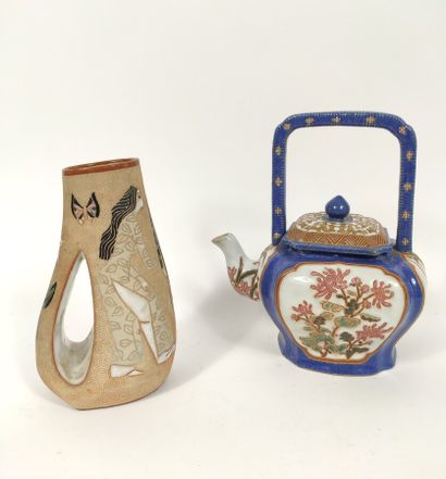  Ceramic teapot, blue glaze and flower medallions, its handle of square shape. 
(restorations,...