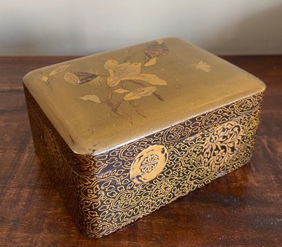  JAPAN. A maki e lacquer box decorated with lotus flowers and bees on a gold background;...