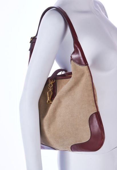 ANONYMOUS 
Burgundy canvas and leather bag,...