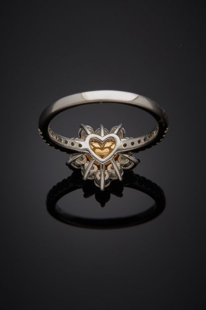  Platinum (950‰) and white gold (750‰) "cOur" ring set with a FANCY YELLOW diamond...