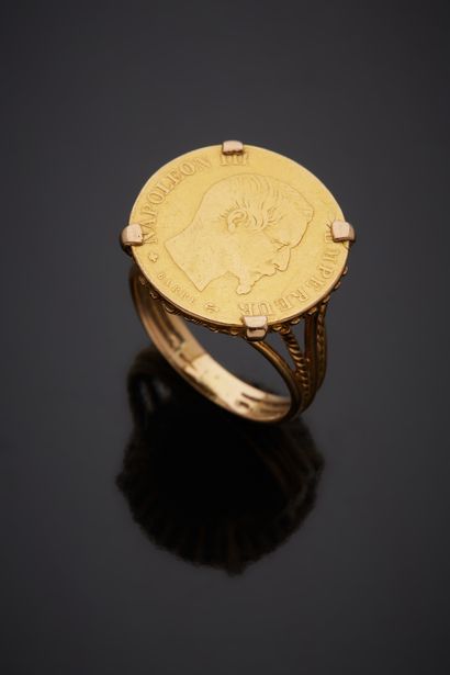  Yellow gold (750‰) ring partially twisted, holding a 10 Francs Napoleon III gold...