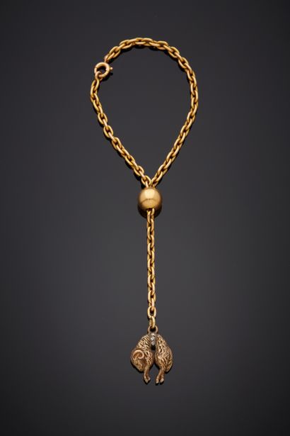  BRACELET «toison d'or» en or jaune (750‰) retenant une perle en or et un bélier...