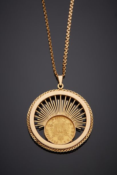  Important yellow gold (750‰) openwork circular PENDANT and its CHAINLET, with radiating...