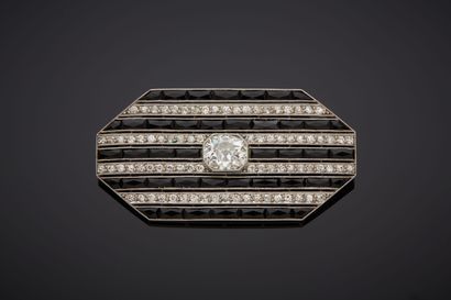 A platinum (950‰) octagonal brooch set with...