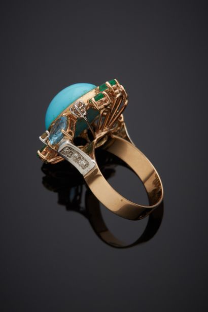  Yellow and white gold (585‰) 14-karat openwork ring set with an oval cabochon turquoise,...