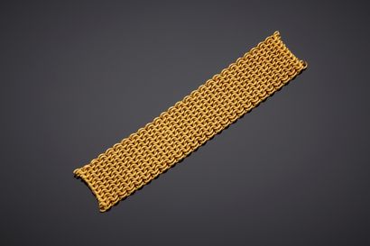  DEBRIS d'or jaune (750‰) anciennement partie de bracelet en cote de maille. Poids...