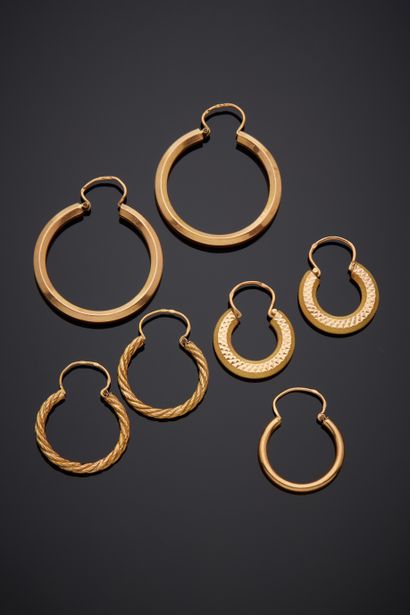 Three pairs of yellow gold (750‰) twisted,...
