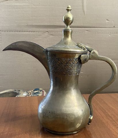 Ewer 
Brass engraved and inlaid with black...