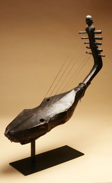 Harp with five strings, the handle carved...