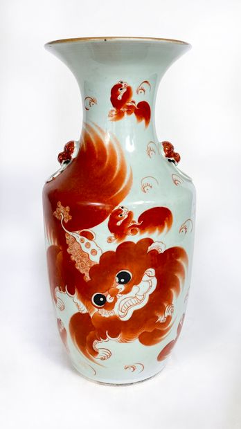 Large porcelain vase decorated with a red...