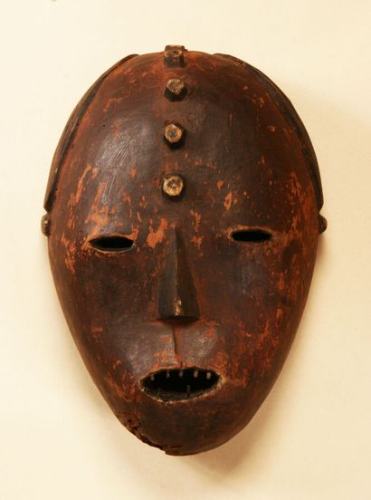 Mask, with five circular scarifications on...