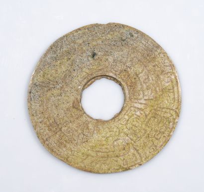Large bi disc in carved stone with archaic...