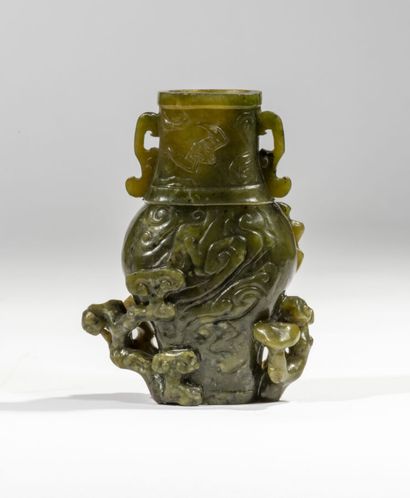 Spinach green jade vase carved in the archaic...