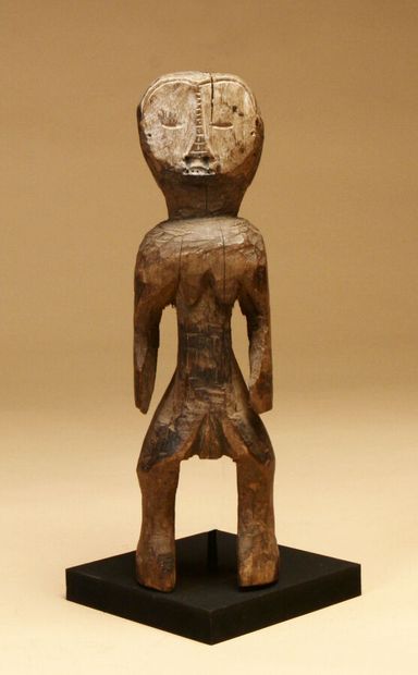 Small female statue in hardwood with natural...