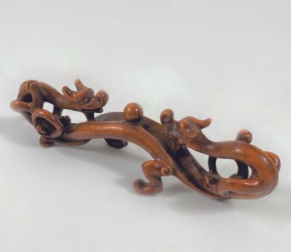 Brush holder in the shape of two intertwined...