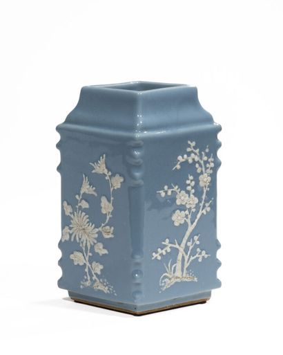 Blue ceramic vase in the shape of a diamond...
