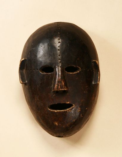 Mask with scarified forehead, wood with brown...