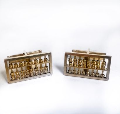Pair of gold cufflinks in the shape of an...