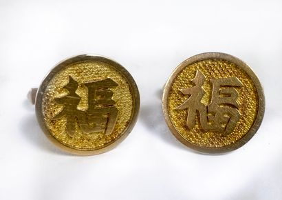 Pair of round gold cufflinks with Fu character...