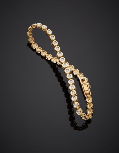 BRACELET in yellow gold (750‰) set with forty...