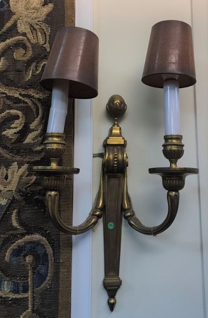 Gilded bronze wall lights in the Louis XVI...